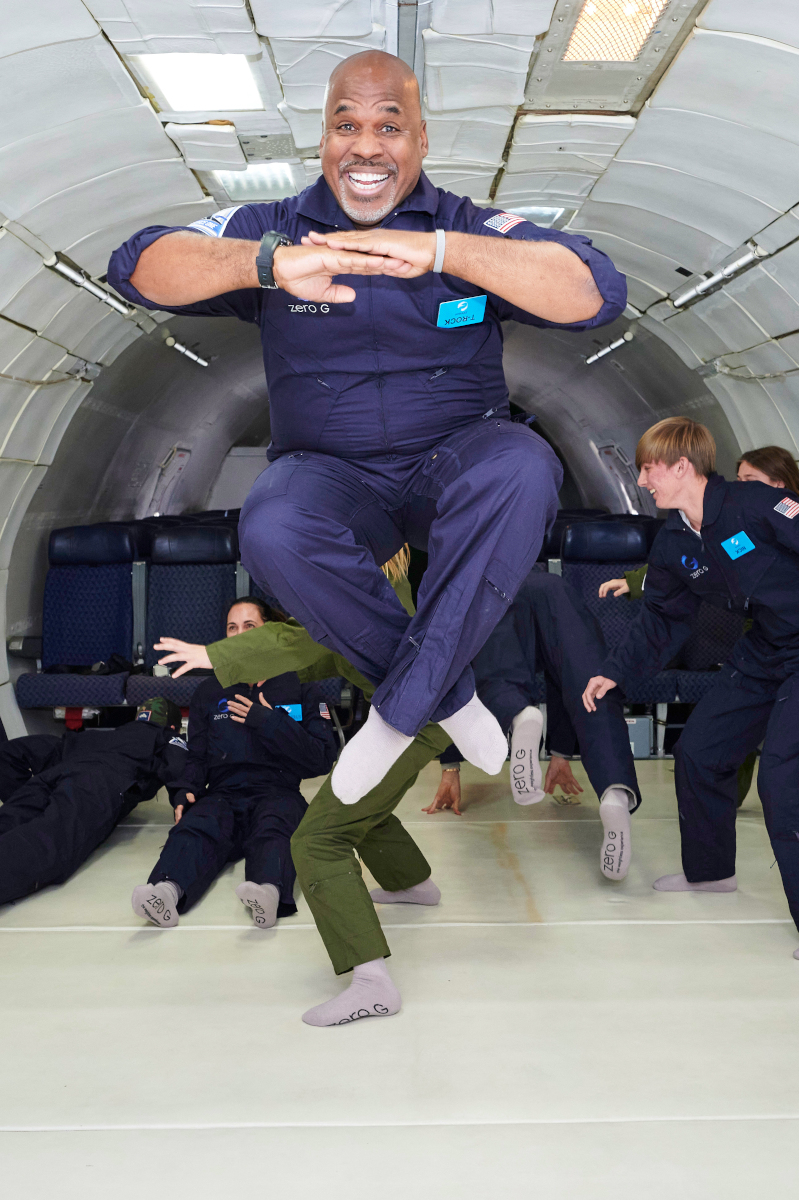 a man floating in the air at zero gravity